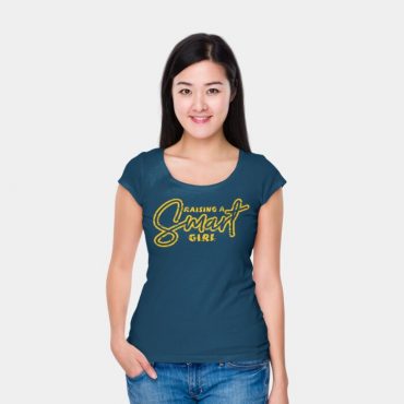 Woman with her hands in her pocket wearing raising a smart girl t-shirt