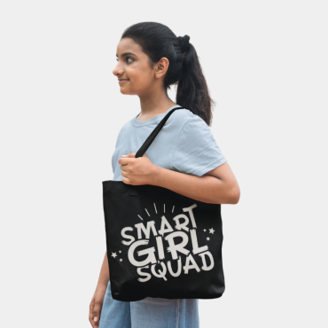 Girl smiling wearing her smart girl squad tote bag